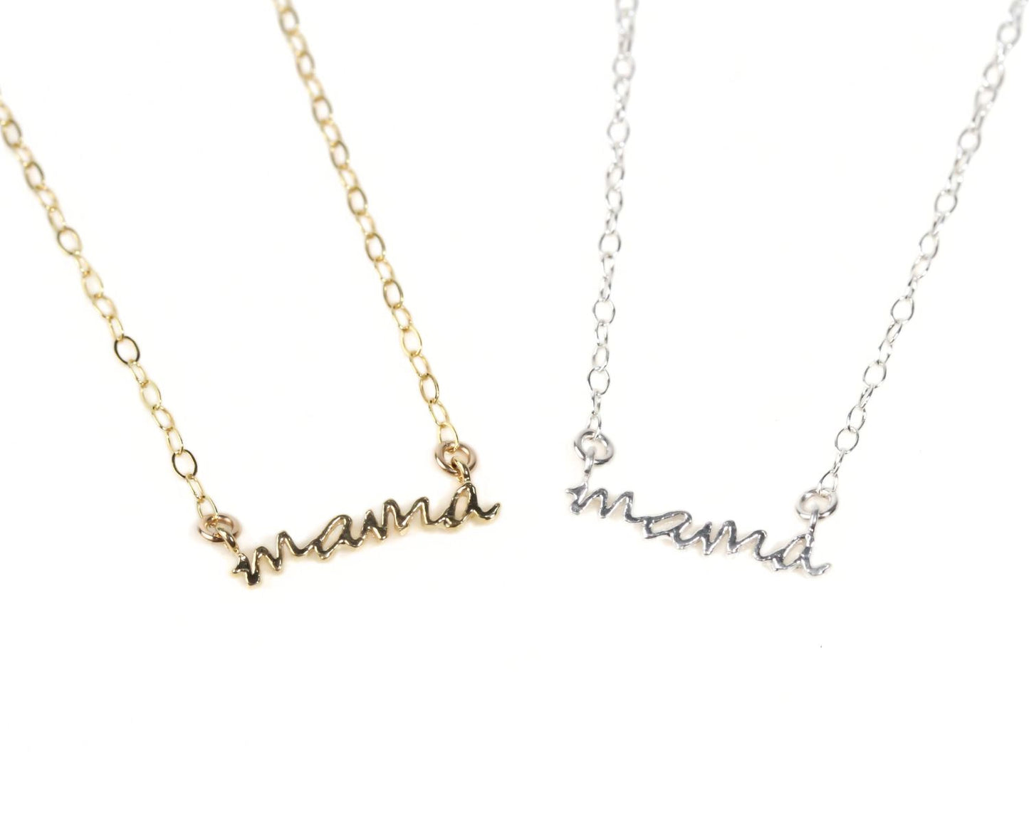 Two necklaces with the word "mama" engraved on them.