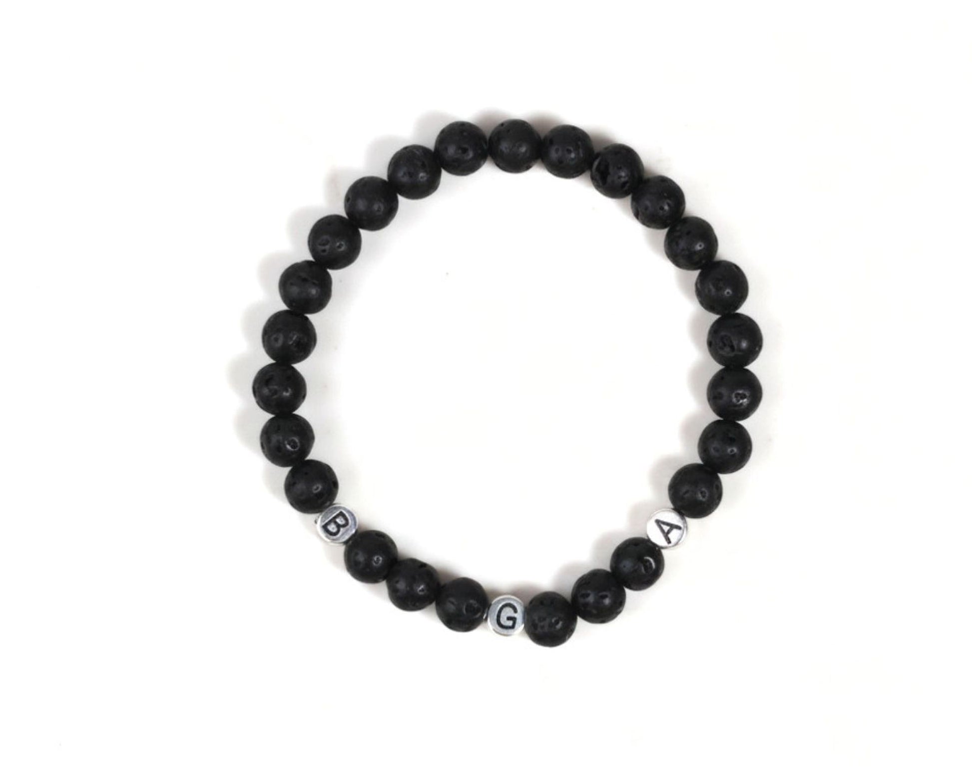 A bracelet made of black beads arranged in a circular pattern.