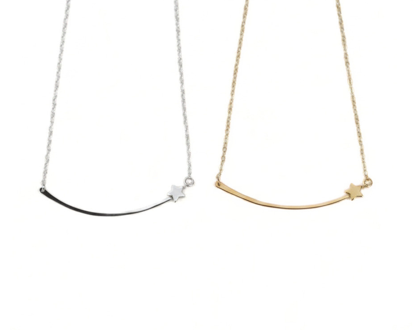 Two necklaces with a curved bar and stars on them, one silver and one gold.