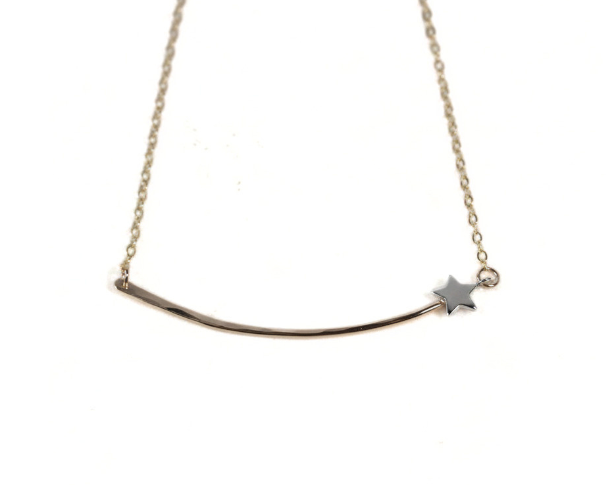 A delicate necklace with a curved bar and a small star charm.