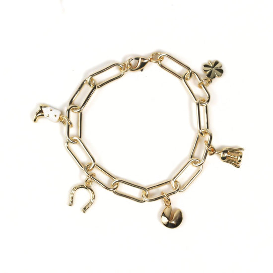 A gold-colored charm bracelet with various charms attached to it.