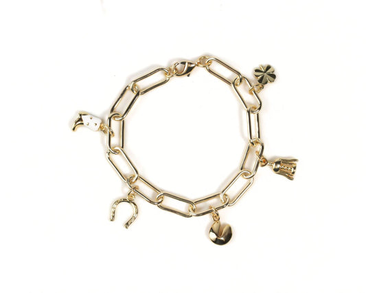 A gold-colored charm bracelet with various charms attached to it.