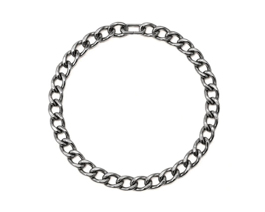 A silver-colored metal necklace with a circular chain design.