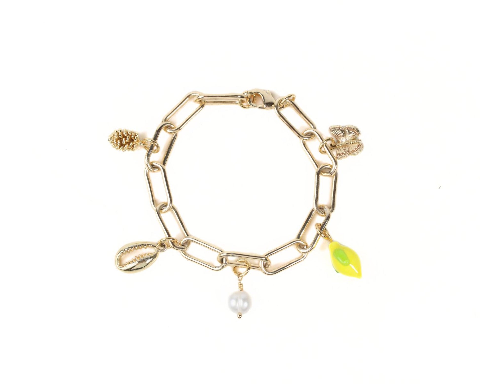 A gold-colored bracelet with various charms attached to it, including a pine cone, a pearl, and a yellow leaf-shaped charm.