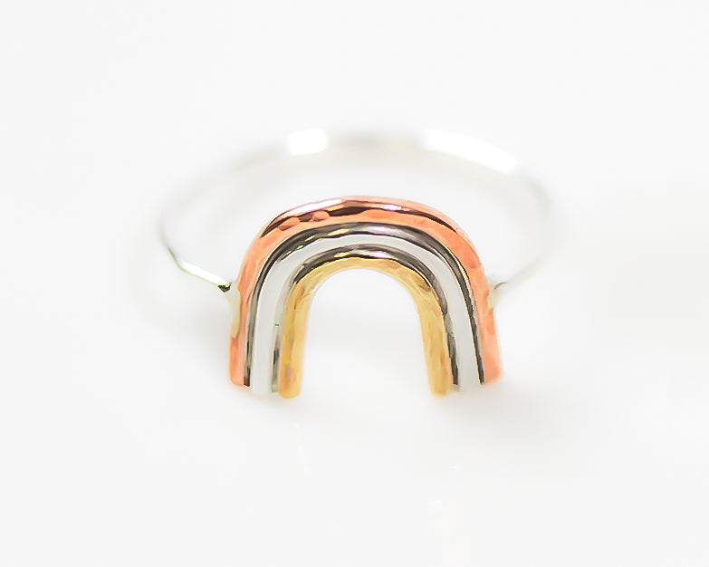 Photo shows our tri-metal mixed metal mini rainbow ring in copper, brass and sterling silver. All handmade and handcrafted in the USA. Offered in US Ring Sizes. Delicate, meaningful, the perfect gift. Representing hope and joy. Inspirational.