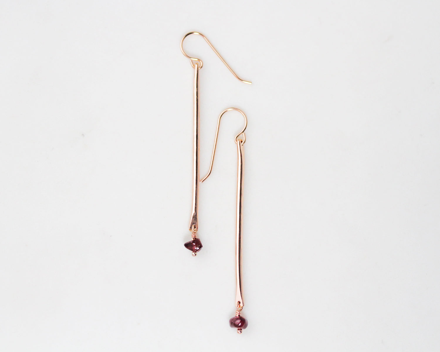 Image shows the Birthstone Pendulum Earrings in 14 karat yellow gold filled with a garnet drop. Ear wires are high quality 14 karate yellow gold filled. Personalized with your birthstone of choice. Makes a perfect, custom gift for her.