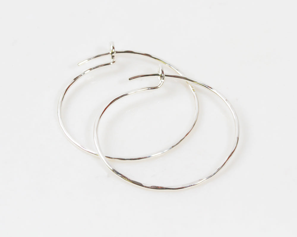 Diana Porter plain silver earring hoops.